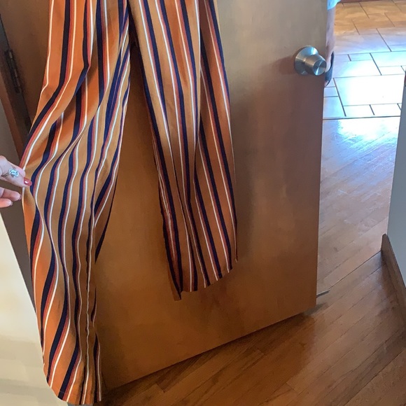 Rust colored jumpsuit with stripes and open back - Picture 2 of 4